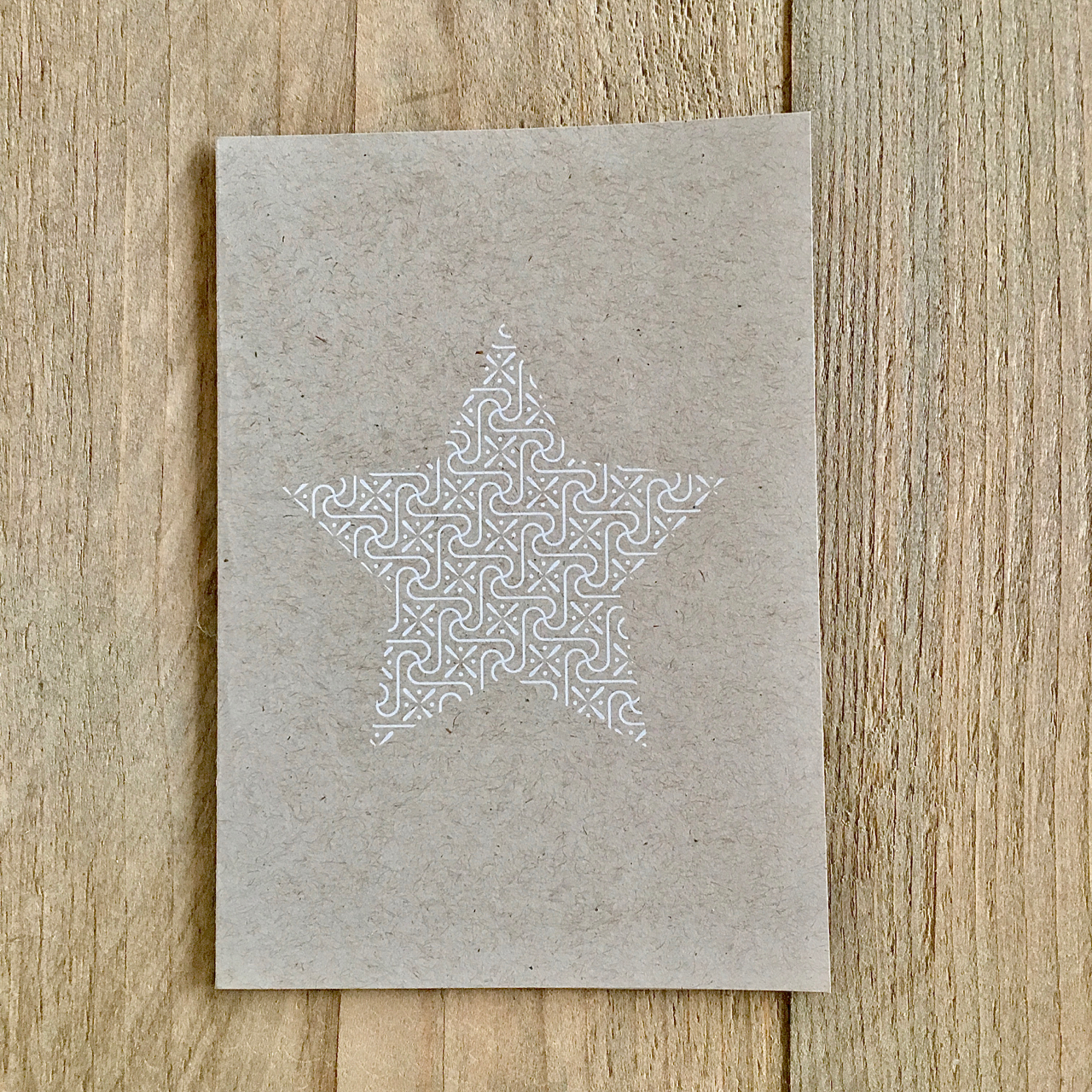 Stern in Weiß auf der Weihnachtskarte