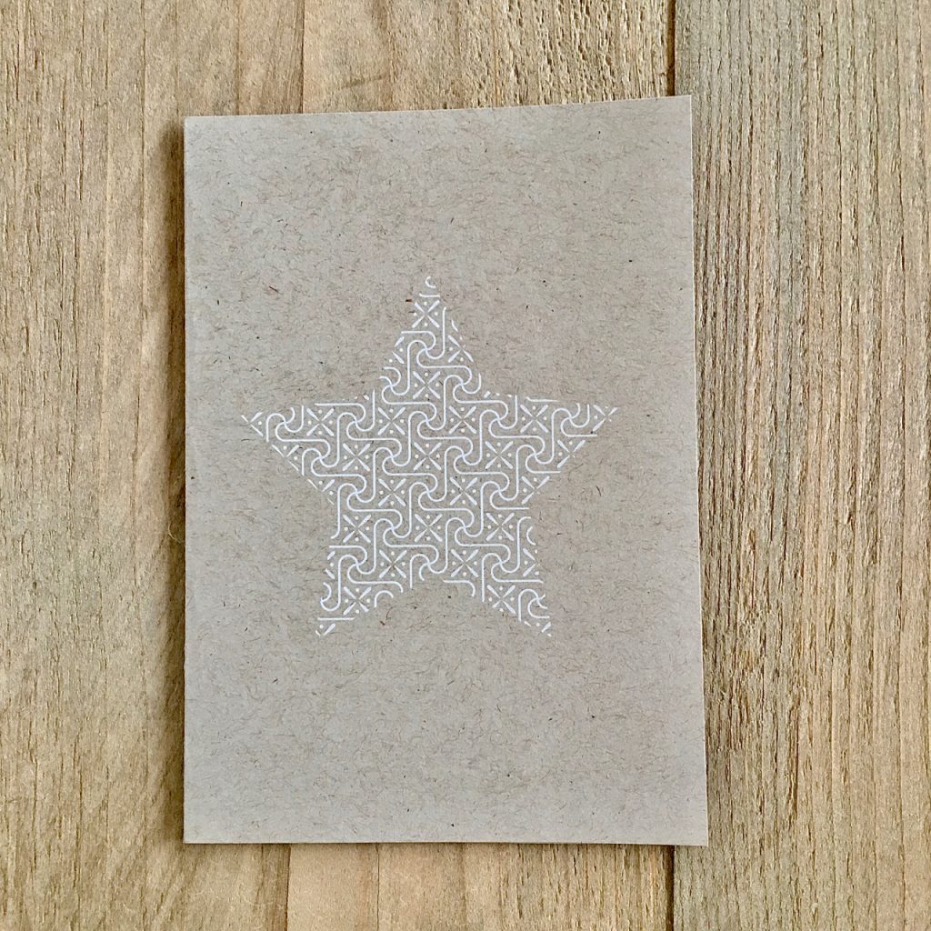 Stern in Weiß auf der Weihnachtskarte